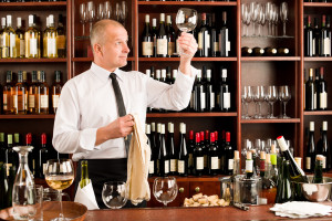 Wine bar waiter clean glass in restaurant